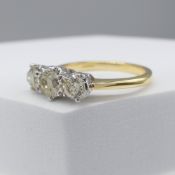 18ct yellow and white gold 1.16 carat diamond trilogy ring, with certificate.