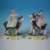 Pair Staffordshire Pottery Girl/Boy On Goats, With Flower Baskets