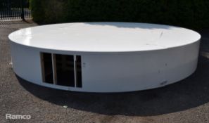 White circular wooden rostrum that Rita Ora performed her medley on in the Semi Final 1 interval