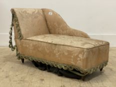 A late 19th century miniature chaise longue, upholstered in tasselled silk damask, raised on