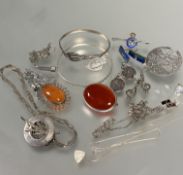 A collection of silver and white metal jewelry including two oval carnelian brooches, a pair of