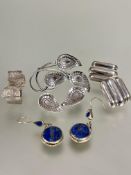 A pair of of white metal textured of nugget style earrings, ( L x 1 cm x W x 1.5 cm), , a pair of