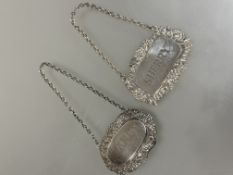 A modern Birmingham silver chased Sherry decanter label, 12.8g and a Epns Brandy decanter label. (