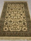CONTEMPORARY RUG - green ground with multiple floral and foliage pattern borders, label for 
