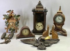 A JUNGHANS GERMAN WALL CLOCK - circular dial with Roman numerals and visible pendulum, 45cms H, a