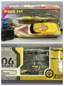 AN AQUAJET REMOTE CONTROLLED SPORT VEE, 74cms (boxed) and a Syma Alloy Shark remote control