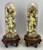 VICTORIAN GLASS DOMES, A PAIR - containing a pair of continental bisque figures of a boy and girl