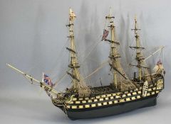 HANDMADE WOODEN MODEL OF A THREE MASTED BRITISH WAR SHIP - 87cms H, 95cms L