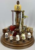 19TH CENTURY CIRCULAR MAHOGANY BOBBIN STAND with pin cushion centre, turned centre column with