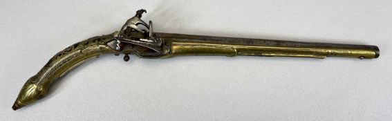 AN 18TH CENTURY FLINTLOCK PISTOL OF EASTERN ORIGIN - 34cms steel barrel with proof marks, brass