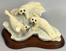 BORDER FINE ARTS FIGURE - Seal Pups, RW63, on wooden stand, 12cms H, boxed