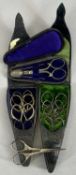 19TH CENTURY MOROCCAN LEATHER SCISSORS CASES (2) with plush lined interiors containing graduated