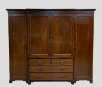 LARGE EDWARDIAN MAHOGANY BREAK-FRONT WARDROBE COMPACTUM, angled cornice, plain frieze, panelled