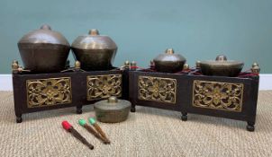 LATE 20TH CENTURY GROUP INDONESIAN GAMELAN GONGS, on two carved wood stands, largest gong 33cms