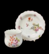 CHELSEA PORCELAIN FINGER BOWL & STAND, c. 1755, both painted with a spray of mixed flowers, framed