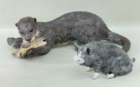 SALLIE WAKLEY (b. 1967) raku fired ceramic - otter with prey, 46cms long, together with similar