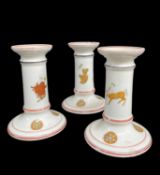 SET OF THREE CONTINENTAL PORCELAIN TABLE CANDLESTICKS, printed and coloured in the Etruscan style,