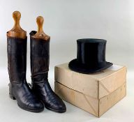BOXED VINTAGE TOP HAT in black silk, together with a pair of vintage black leather riding boots with