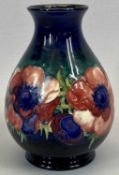 PRE-WAR MOORCROFT ANEMONE PATTERN BALUSTER VASE - with tube lined decoration, on green/blue