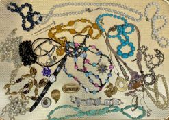 COSTUME JEWELLERY and other collectables contained in a vintage biscuit tin