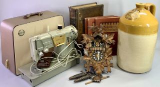 A CARVED WOOD CUCKOO CLOCK with musical movement, 33cms H, Price of Bristol 19th century stoneware