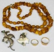 9CT GOLD RINGS (2), amber necklaces (2), 900 silver stamped brooches (2), the rings include a lady's
