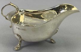 SILVER SAUCE BOAT - Birmingham 1964, Maker Hampton Utilities, having a scroll form handle, raised on
