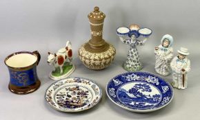 A FRENCH FAIENCE FIGURAL DOUBLE SALT, Brittany circa 1910 modelled as a two sided lady in floral