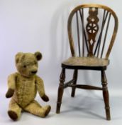 A CHILD'S ELM WHEELBACK CHAIR - late 19th century with solid seat, turned supports and stretcher,