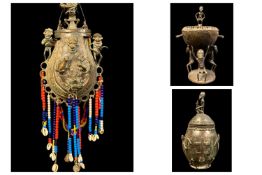 THREE METAL ALLOY CONTAINERS, comprising Cameroon cup and cover, 44.5cm H, Dogon style vessel and