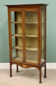 CIRCA 1900 MAHOGANY STRING INLAID TWO DOOR GLAZED DISPLAY CABINET - having three fabric covered