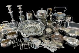 LARGE QUANTITY OF EPNS including pairs of candlesticks, spirit kettle, flatware, pair of bottle