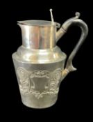 LATE VICTORIAN SILVER FLAT LIDDED JUG, the tapering body with vacant cartouche and embossed