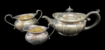 MATCHED SILVER THREE-PIECE TEA SERVICE comprising teapot, sucrier and cream jug, Sheffield