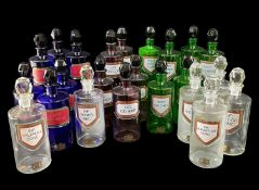ASSORTED 20TH CENTURY CLEAR & COLOURED GLASS APOTHECARY JARS, with coloured and gilt labels and gilt