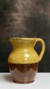EWENNY SLIPWARE POTTERY JUG loop handle, shaped neck, two tone glaze, signed Ewenny Pottery 1911,