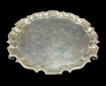 GEORGE V SILVER SALVER, pie crust edge, raised on three feet, Sheffield 1928, Thomas Bradbury &