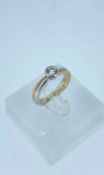 18CT WHITE & YELLOW GOLD DIAMOND SOLITAIRE RING, David Tinsley design, the single stone measuring