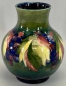 MOORCROFT 'LEAVES & BERRIES' VASE - of squat baluster form, 20cms H