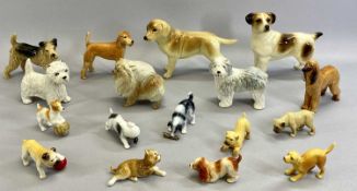 SUE NIVEN, SCOTLAND - two ceramic dogs, 11cms H, and a collection of other ceramic dog figures