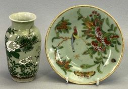 A CHINESE EXPORT CELADON CIRCULAR SHALLOW DISH painted in famille rose with blossom, bird and