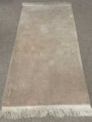 RUG - beige with floral pattern, label for 