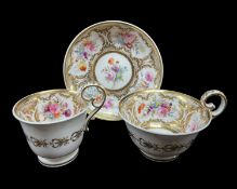 NANTGARW PORCELAIN TRIO circa 1818-1820, having elevated loop handles, painted with panels of flower