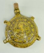 EWENNY SLIPWARE POTTERY COSTREL circular based with four loop handles, green mottled glaze,