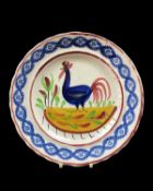 GOOD LLANELLY POTTERY COCKEREL PLATE, circa 1900, continuous sponged floral border in blue, the
