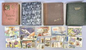 VINTAGE POSTCARDS to include three albums of UK, tea card albums and memorial cards. Also, a vintage