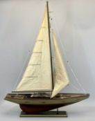 A WOODEN MODEL OF A SAILING SHIP - single masted with full rigging, 99cms H, 78cms L