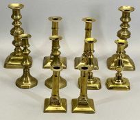 19TH CENTURY BRASS CANDLESTICKS, A PAIR - with square bases and cylindrical columns, 19.5cms H, a
