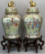 LARGE CHINESE FAMILLE ROSE LIDDED BALUSTER VASES, A PAIR - enamelled painted with figures and