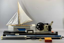 A POND YACHT - with wooden hull and metal heel, painted in blue and cream, 53cms L fully rigged, a